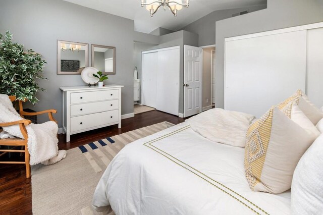 3362 Edgeview, San Marcos, CA 92078 - bedroom featuring a chandelier, wood finished floors, lofted ceiling, multiple closets, and baseboards