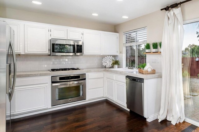 3362 Edgeview, San Marcos, CA 92078 - kitchen featuring stainless steel appliances, a sink, light countertops, dark wood-style flooring, and recessed lighting