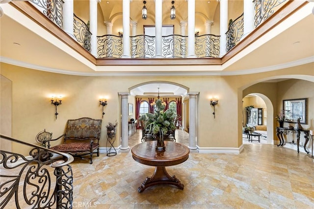 367 Monterey Pines Dr, Arcadia, CA 91006 - entryway featuring a high ceiling, ornate columns, arched walkways, and baseboards