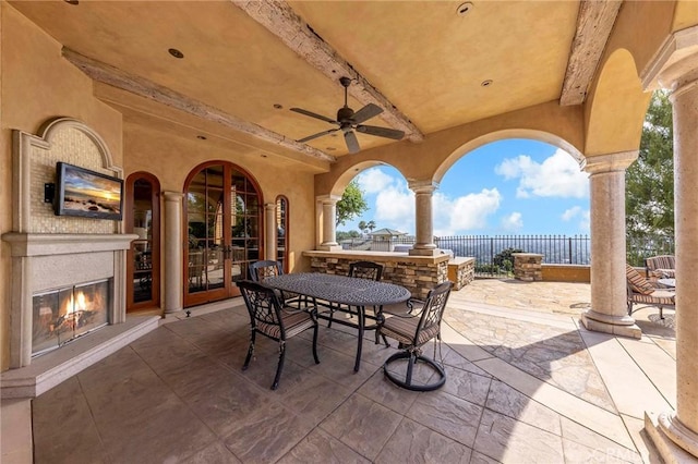 367 Monterey Pines Dr, Arcadia, CA 91006 - view of patio / terrace with a glass covered fireplace, fence, outdoor dining area, and ceiling fan