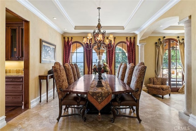 367 Monterey Pines Dr, Arcadia, CA 91006 - dining area with ornate columns, arched walkways, a chandelier, a tray ceiling, and crown molding