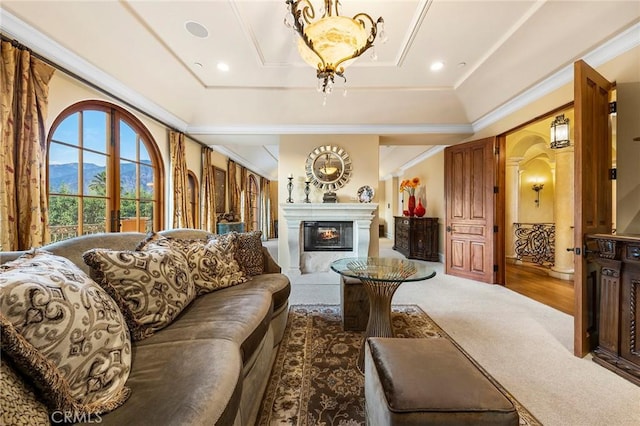 367 Monterey Pines Dr, Arcadia, CA 91006 - carpeted living room featuring a tray ceiling, arched walkways, crown molding, and a glass covered fireplace