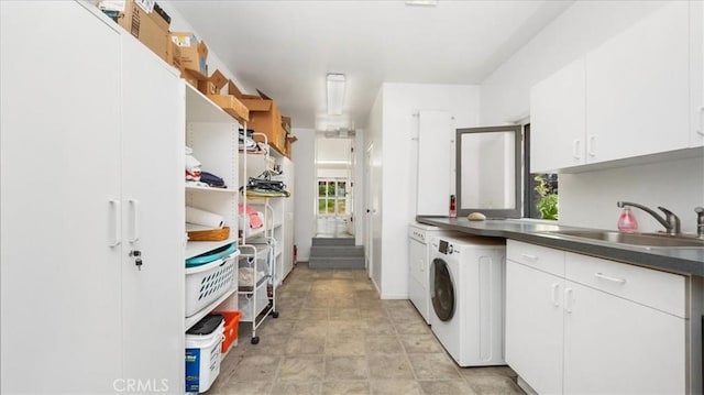 2304 Rosedale Curv, Upland, CA 91784 - washroom featuring washer / clothes dryer, cabinet space, and baseboards