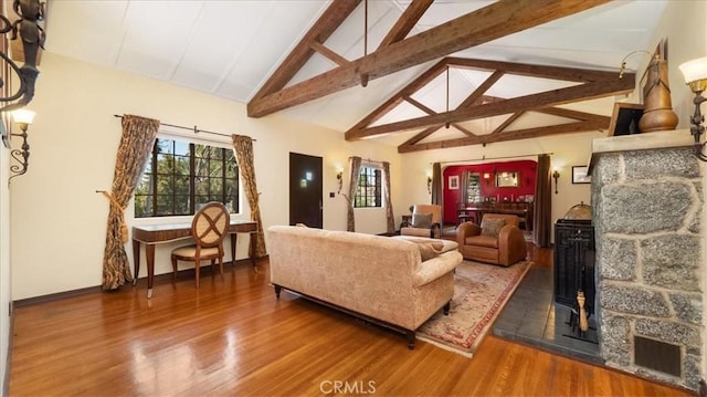 2304 Rosedale Curv, Upland, CA 91784 - living room with wood finished floors, beamed ceiling, baseboards, and high vaulted ceiling