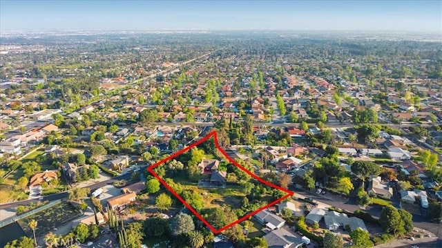 2304 Rosedale Curv, Upland, CA 91784 - aerial view of property and surrounding area with property parcel outlined and nearby suburban area