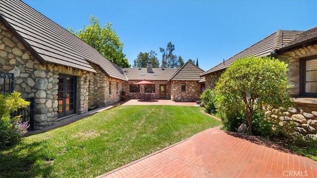 2304 Rosedale Curv, Upland, CA 91784 - view of grassy yard with a patio area and french doors