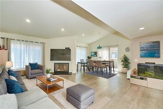 960 Golden Springs Dr Unit F, Diamond Bar, CA 91765 - living room featuring light wood-type flooring, lofted ceiling, a glass covered fireplace, recessed lighting, and baseboards