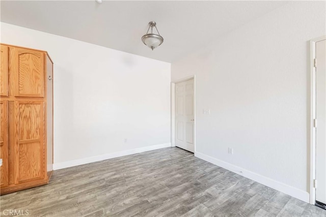 41410 Juniper St Unit 2622, Murrieta, CA 92562 - unfurnished bedroom featuring wood finished floors and baseboards