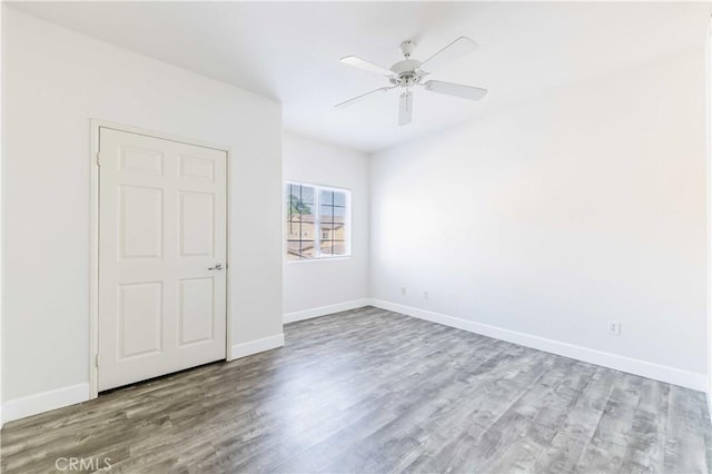 41410 Juniper St Unit 2622, Murrieta, CA 92562 - unfurnished room with wood finished floors, baseboards, and a ceiling fan