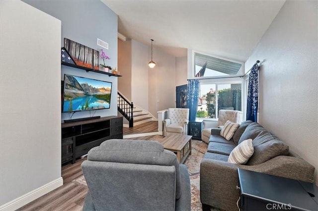 3079 Mojave Ct, Highland, CA 92346 - living room featuring wood finished floors, baseboards, and high vaulted ceiling
