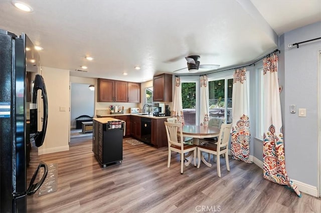 3079 Mojave Ct, Highland, CA 92346 - dining area featuring baseboards, ceiling fan, light wood-style flooring, and recessed lighting
