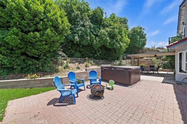 3079 Mojave Ct, Highland, CA 92346 - view of patio with a hot tub, a fire pit, and a balcony