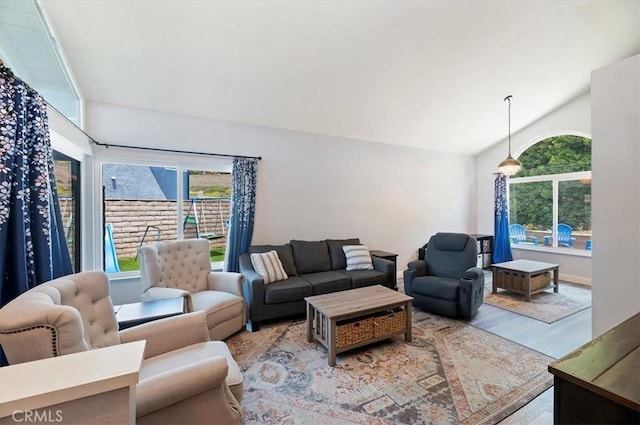 3079 Mojave Ct, Highland, CA 92346 - living room featuring plenty of natural light, wood finished floors, and vaulted ceiling