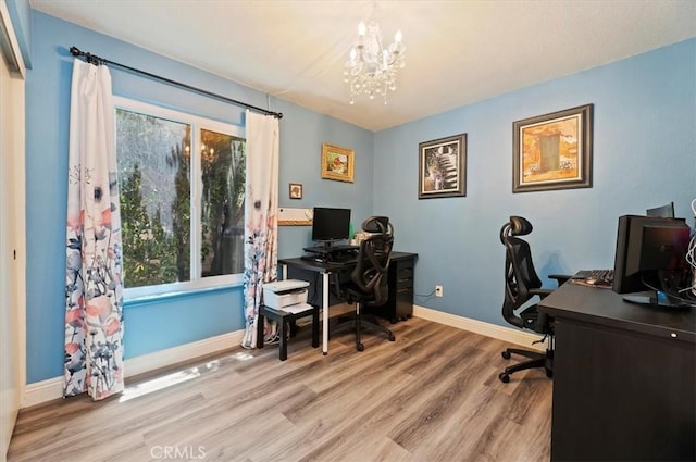 3079 Mojave Ct, Highland, CA 92346 - office with a chandelier, wood finished floors, and baseboards