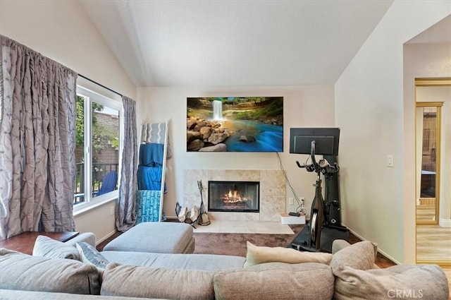 3079 Mojave Ct, Highland, CA 92346 - living room with a fireplace, baseboards, lofted ceiling, and wood finished floors