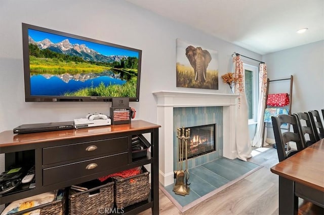 3079 Mojave Ct, Highland, CA 92346 - living area with wood finished floors and a fireplace