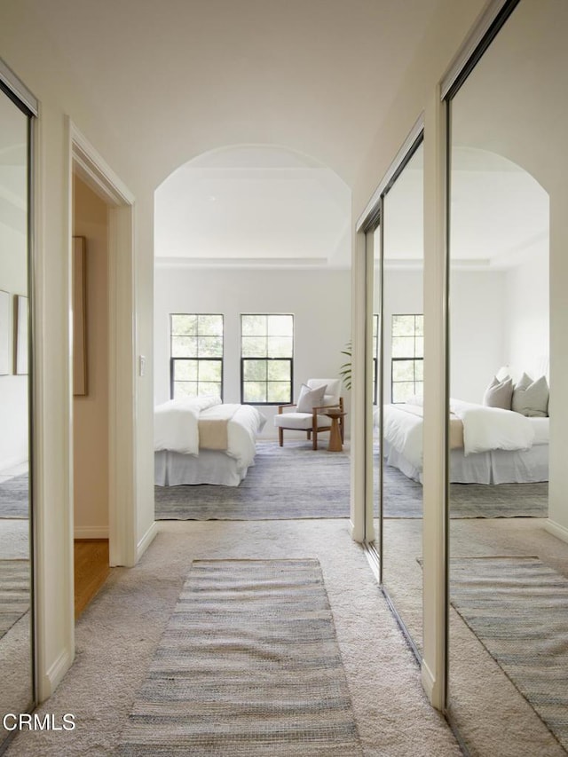 12603 Moorpark St Unit 303, Studio City, CA 91604 - corridor with arched walkways, carpet flooring, and baseboards