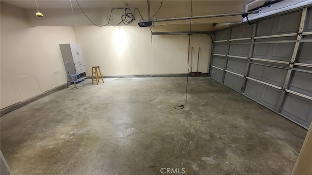 2059 E Yale St, Ontario, CA 91764 - garage with a garage door opener and baseboards