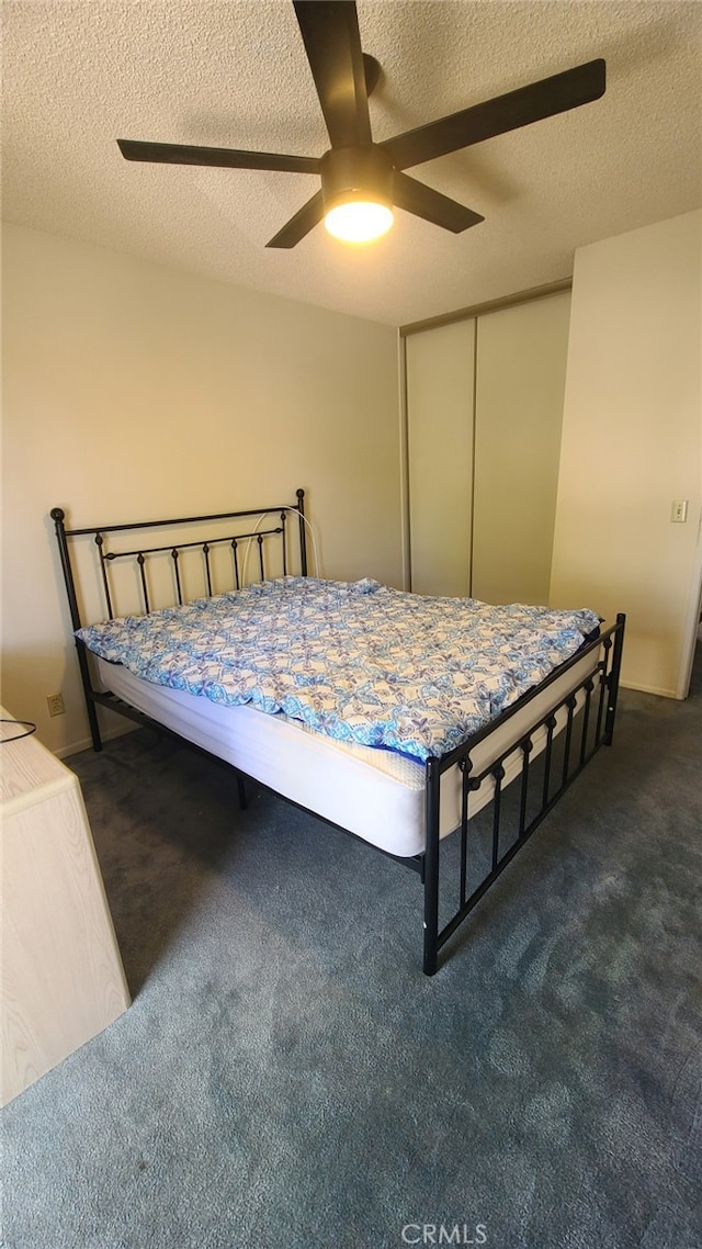 2059 E Yale St, Ontario, CA 91764 - bedroom featuring dark carpet, ceiling fan, a textured ceiling, and a closet