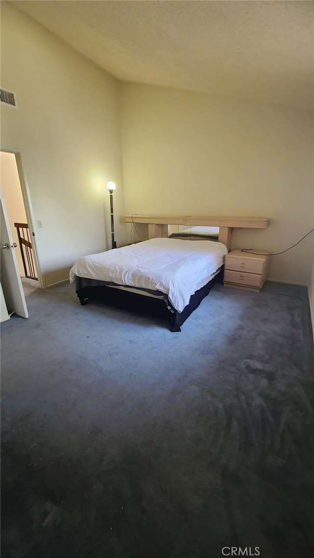 2059 E Yale St, Ontario, CA 91764 - bedroom with dark carpet and vaulted ceiling