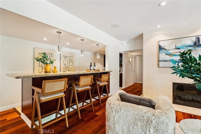 3336 Villa Mesa Rd, Pasadena, CA 91107 - indoor wet bar featuring dark wood-type flooring, recessed lighting, decorative light fixtures, and a glass covered fireplace