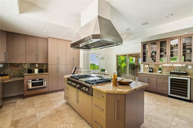 3336 Villa Mesa Rd, Pasadena, CA 91107 - kitchen featuring wine cooler, appliances with stainless steel finishes, island exhaust hood, backsplash, and light stone countertops