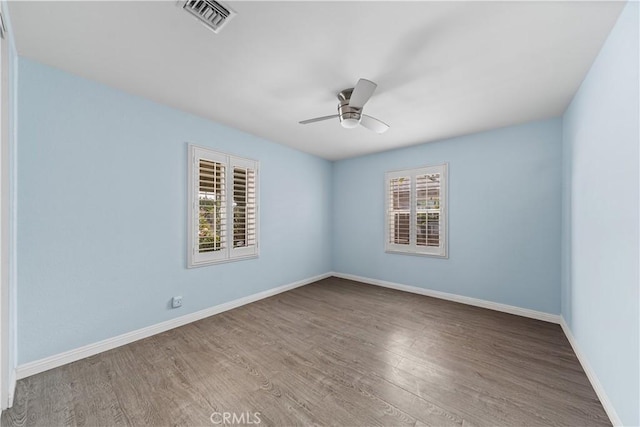 15439 Studebaker Rd, Norwalk, CA 90650 - spare room featuring wood finished floors, a ceiling fan, and baseboards