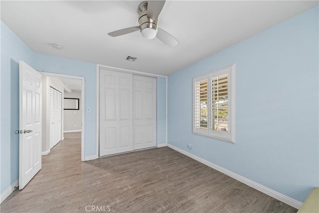 15439 Studebaker Rd, Norwalk, CA 90650 - unfurnished bedroom featuring wood finished floors, baseboards, and a closet