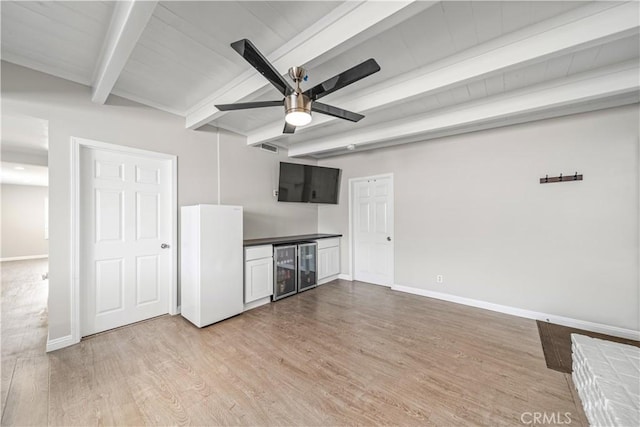 15439 Studebaker Rd, Norwalk, CA 90650 - unfurnished living room with wine cooler, light wood-style floors, beam ceiling, baseboards, and ceiling fan