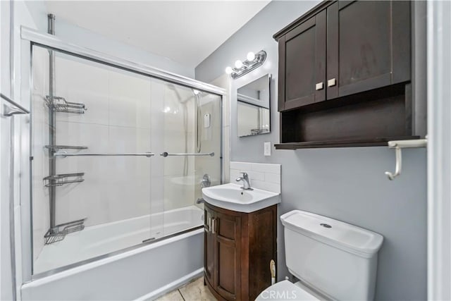 15439 Studebaker Rd, Norwalk, CA 90650 - full bathroom with toilet, enclosed tub / shower combo, vanity, and tile patterned flooring