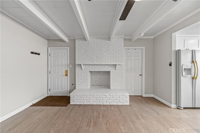 15439 Studebaker Rd, Norwalk, CA 90650 - unfurnished living room featuring light wood-style floors, beamed ceiling, baseboards, and a brick fireplace