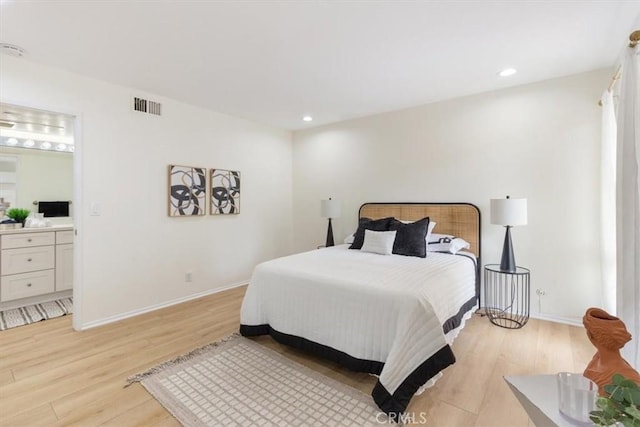 bedroom featuring light wood-style floors, recessed lighting, baseboards, and ensuite bath