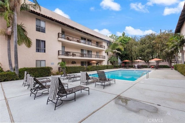 community pool with a patio