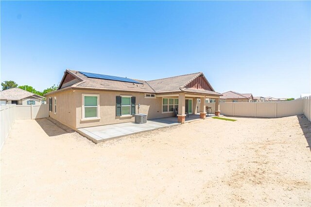 2044 E Lingard St, Lancaster, CA 93535 - back of house featuring roof mounted solar panels, a patio, a fenced backyard, and stucco siding