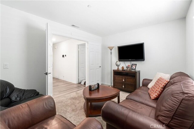 2044 E Lingard St, Lancaster, CA 93535 - living area with light wood-style flooring