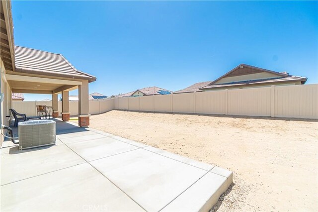 2044 E Lingard St, Lancaster, CA 93535 - fenced backyard featuring a patio and central air condition unit