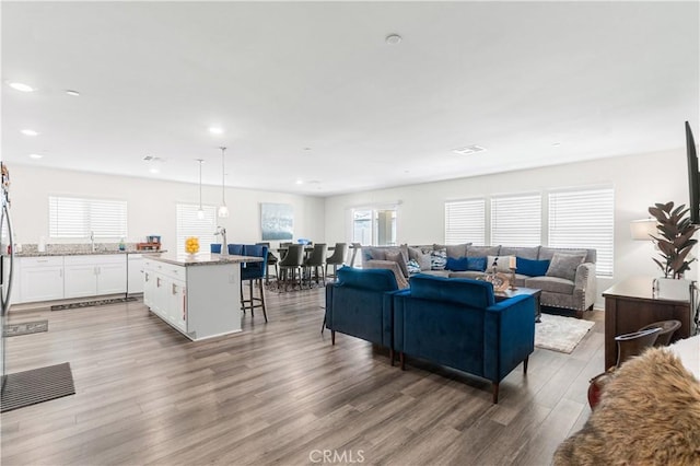 2044 E Lingard St, Lancaster, CA 93535 - living area with wood finished floors, healthy amount of natural light, and recessed lighting