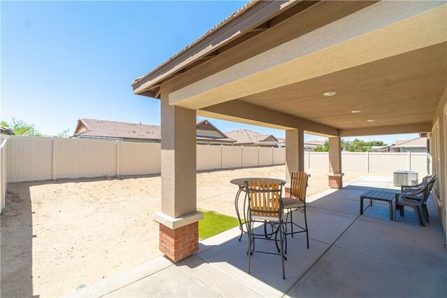 2044 E Lingard St, Lancaster, CA 93535 - view of patio / terrace with a fenced backyard and central air condition unit