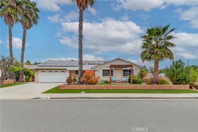 27930 Lexington Ct, Menifee, CA 92586 - ranch-style house featuring roof mounted solar panels, a garage, and concrete driveway