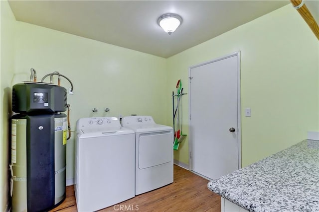 27930 Lexington Ct, Menifee, CA 92586 - laundry area with independent washer and dryer, light wood-type flooring, and water heater