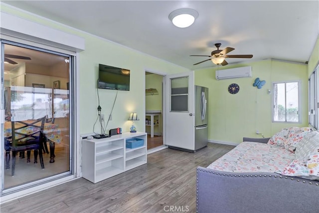 27930 Lexington Ct, Menifee, CA 92586 - living area featuring ceiling fan, a wall mounted AC, wood finished floors, lofted ceiling, and baseboards