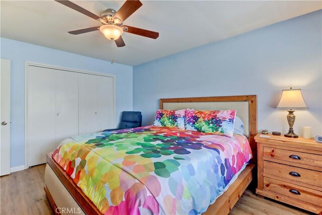 27930 Lexington Ct, Menifee, CA 92586 - bedroom featuring light wood-style floors, a closet, and ceiling fan