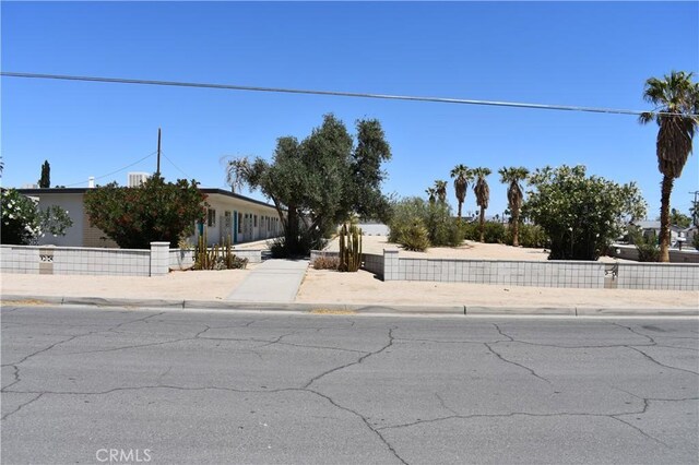 73636 Cactus Dr Unit 29, Palms, CA 92277 - view of property hidden behind natural elements featuring fence