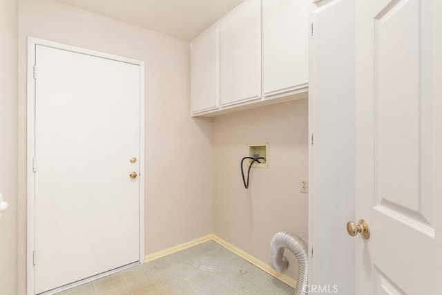 laundry room featuring cabinet space, hookup for a washing machine, baseboards, and light floors