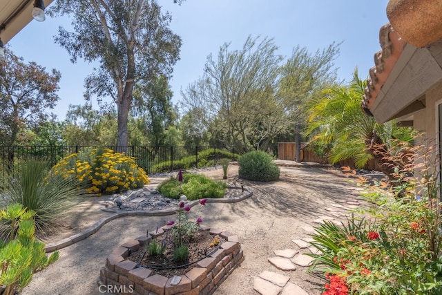 fenced backyard with a patio area