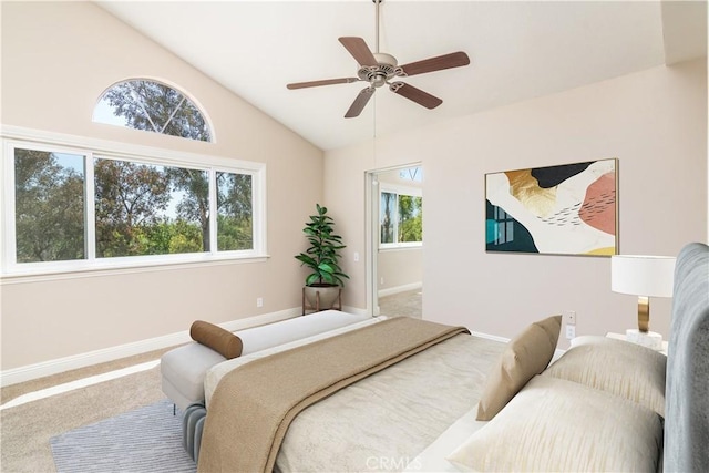 bedroom featuring carpet, baseboards, lofted ceiling, and ceiling fan