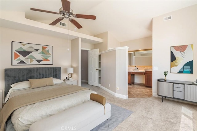 bedroom with light carpet, baseboards, high vaulted ceiling, ensuite bathroom, and ceiling fan