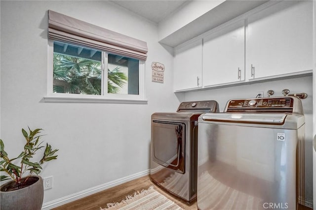 1836 Macinnes Pl, Placentia, CA 92870 - laundry room with cabinet space, washing machine and dryer, light wood-type flooring, and baseboards