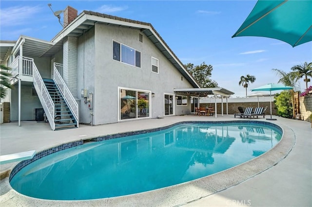1836 Macinnes Pl, Placentia, CA 92870 - swimming pool with a patio, a pergola, a diving board, stairway, and fence