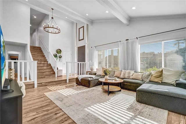 1836 Macinnes Pl, Placentia, CA 92870 - living room with beamed ceiling, wood finished floors, high vaulted ceiling, stairs, and a chandelier